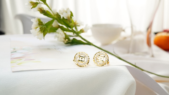 A close up of a pair of earrings on a table